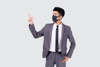 肖像年轻的亚洲商人西装穿脸面具保护科维德孤立的白色背景业务男人。展示显示检疫流感大流行冠状病毒正常的