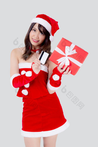 美丽的肖像年轻的亚洲女人快乐持<strong>有</strong>信贷卡红色的礼物盒子圣诞节假期孤立的白色背景美亚洲女孩<strong>惊喜</strong>购物信贷卡圣诞节一天