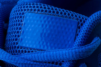 片段蓝色的运动鞋细绳宏运动鞋纹理