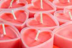 粉红色的蜡烛形式心红色的背景情人节一天
