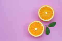 高维生素多汁的甜蜜的新鲜的橙色水果绿色叶子粉红色的背景