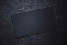 黑色的业务卡黑暗石头平铺背景阳光阴影奢侈品品牌平躺品牌身份设计模型
