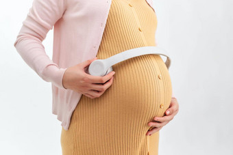 怀孕了女人显示音乐婴儿