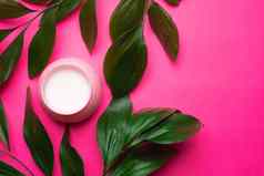 脸奶油绿色叶子美容面部皮肤护理粉红色的背景文章选择奶油水疗中心治疗痤疮光滑的清洁皮肤皮肤营养复制空间
