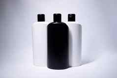 作文白色黑色的洗发水瓶标签身体护理美概念复制空间