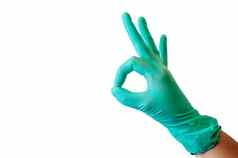 蓝色的乳胶医疗手套女手显示字符好白色背景概念医学健康复制空间
