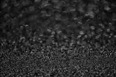 详细的纹理黑色的闪闪发光的灰尘表面