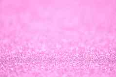 纹理光粉红色的闪闪发光的灰尘表面奢侈品背景散景