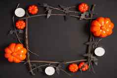 万圣节背景橙色装饰塑料南瓜黑色的纸蝙蝠黑色的纸板感恩节问候卡