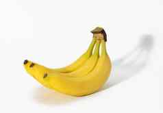 群黄色的成熟的香蕉皮白色背景