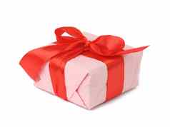 矩形盒子包装粉红色的纸系红色的丝绸丝带白色背景