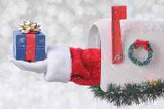 圣诞老人老人手臂持有小圣诞节现在未来邮件盒子银散景背景雪效果