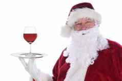 圣诞老人老人持有银盘单红色的酒玻璃孤立的白色