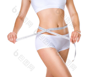 女人测量腰围完美的苗条的身体