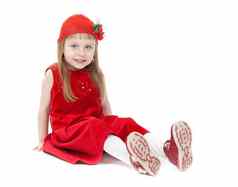 女孩岁的年红色的衣服坐着地板上