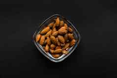 杏仁小板黑色的表格杏仁健康的素食者蛋白质有营养的食物自然坚果零食