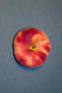 桃子前视图异国情调的水果高丽油桃变形蓝绿色背景
