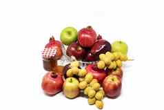 罗什的新年犹太人一年传统的符号蜂蜜玻璃Jar石榴日期红色的绿色苹果