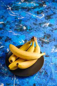香蕉水果黑色的板蓝色的变形背景