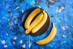 香蕉水果黑色的板蓝色的变形背景