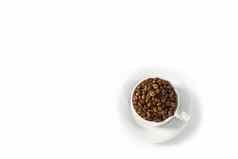 咖啡豆子白色杯特写镜头白色咖啡杯咖啡种子白色背景概念国际一天咖啡