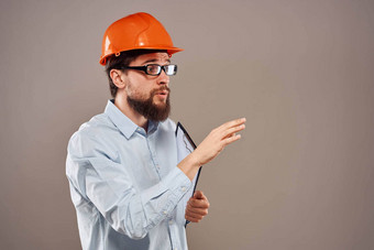 男人。工作统一的橙色头盔服务专业操作手册