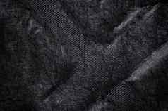 黑色的织物帆布丝绸纹理背景摘要特写镜头细节纺织材料壁纸交叉形状emboss