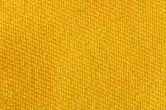 黄色的黄金帆布织物纹理背景纺织装饰概念壁纸室内设计