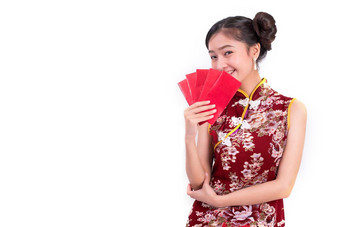 年轻的亚洲美女人穿旗袍持有包钱手势中国人一年节日事件孤立的白色背景假期生活方式概念旗袍衣服穿