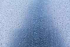 水滴雨滴玻璃变形蓝色的背景