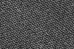 黑暗灰色地毯纹理波浪模式背景