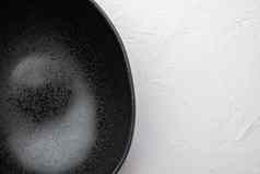 空黑色的碗复制空间文本食物复制空间文本食物前视图平躺白色石头表格背景