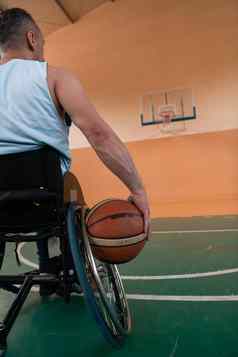照片战争经验丰富的玩篮球现代体育竞技场概念体育运动人残疾的人