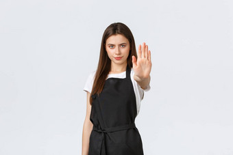 杂货店商店员工小业务咖啡商店概念确定女咖啡师扩展手停止限制禁止行动站黑色的围裙