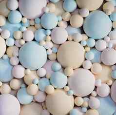 摘要背景柔和的颜色不光滑的球精致的蓝色的粉红色的米色球大小球形形状纹理背景特写镜头
