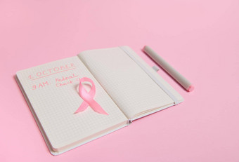 前视图粉红色的丝带打开日记碑文提醒医疗检查10月世界乳房癌症一天10月粉红色的一天世界癌症一天国家癌症幸存者