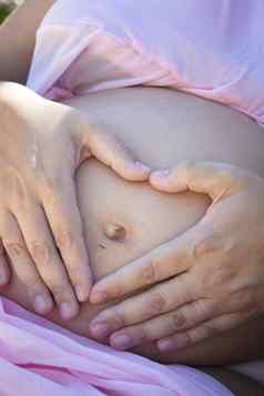 肠道个月怀孕了女人使心手
