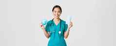 科维德冠状病毒疾病医疗保健工人概念微笑漂亮的亚洲女护士医生实习医生风云显示呼吸器医疗面具建议病人方法病毒保护