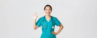 科维德医疗保健工人防止病毒概念友善的微笑亚洲女医生医生实习医生风云挥舞着手问候病人不错的