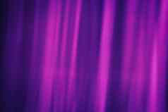温柔的模糊射线品红色的颜色黑暗紫色的背景抽象窗帘