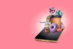 移动电话粉红色的背景甜甜圈糖果拐杖咖啡饼干色彩斑斓的马卡龙拼贴画复制空间特写镜头