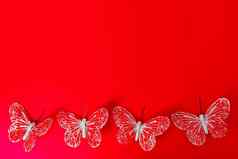 情人节一天概念红色的蝴蝶红色的背景问候卡片复制空间