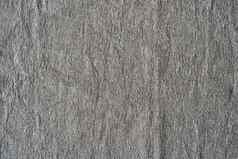 自然亚麻纹理背景皱巴巴的织物灰色的颜色粗糙的纹理