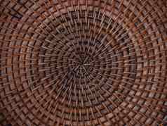 美丽的模式手工制作的编织篮子细节柳条艺术作品背景圆结构纹理轮传统的精心制作手工艺品藤托盘自然棕色（的）竹子家具