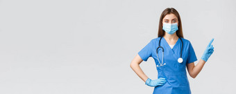 科维德防止病毒健康医疗保健工人检疫概念自信女护士蓝色的实习医生风云医疗面具提供信息指出手指