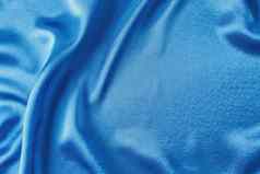 蓝色的丝绸背景折叠摘要纹理波及缎表面