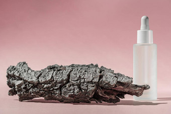 血清石油胶原蛋白肽白色透明的瓶下降粉红色的背景树皮树护肤品美治疗医疗护肤品模型包装化妆品产品