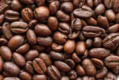 咖啡豆子背景背景烤咖啡豆子宏照片炸棕色（的）咖啡豆子表格