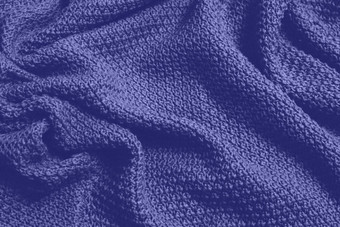 经典蓝色的颜色单色纹理针织织物蓝色的针织泽西岛纺织背景经典蓝色的颜色背景羊毛针织纹理时尚的颜色
