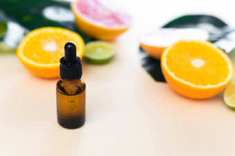 血清至关重要的柑橘类石油维生素石灰橙色柠檬美护理抗衰老自然化妆品背景柑橘类水果